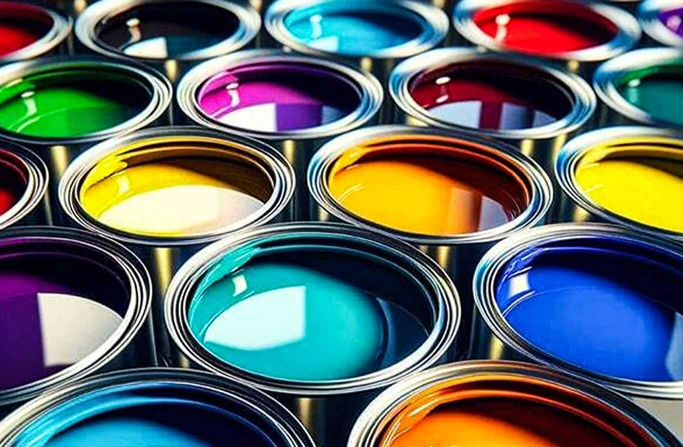 Selection of brightly colored paint in open cans